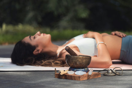 woman meditating with crystals