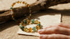  “Abundance bracelet with manifestation list on paper”]