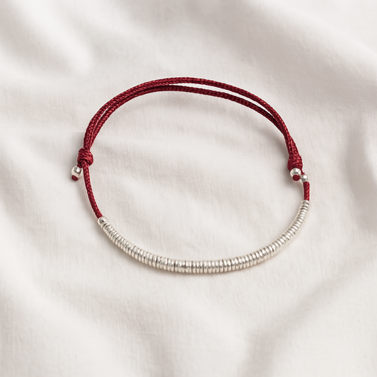 Red String Wealth Coil Bracelet – Minimalist Silver Talisman for Flow & Fortune
