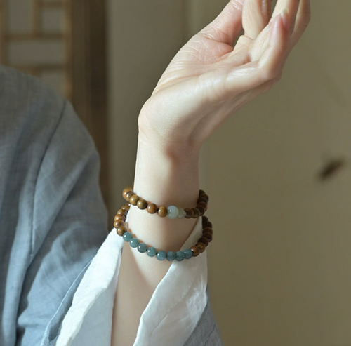 Blue Jade and Sandalwood double-layer bracelet with gourd charm, crafted for relaxation and inviting good fortune in off mode rituals.